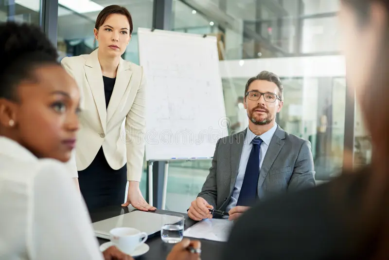 business-people-meeting-discussion-team-boardroom-corporate-finance-collaboration-office-group-employees-318354887 CFAs collaborating during strategic decision-making in 2025