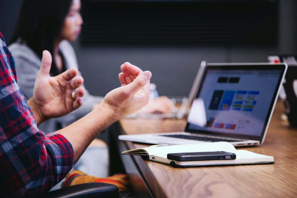 headway-5QgIuuBxKwM-unsplash best financial advisors discussing portfolio strategy with clients