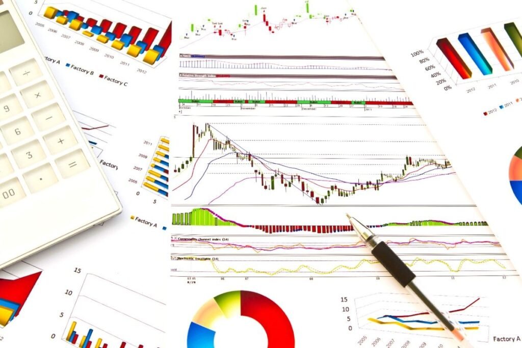 paperwork-with-colorful-graphs-min (1) Candlestick chart patterns from technical analysis books